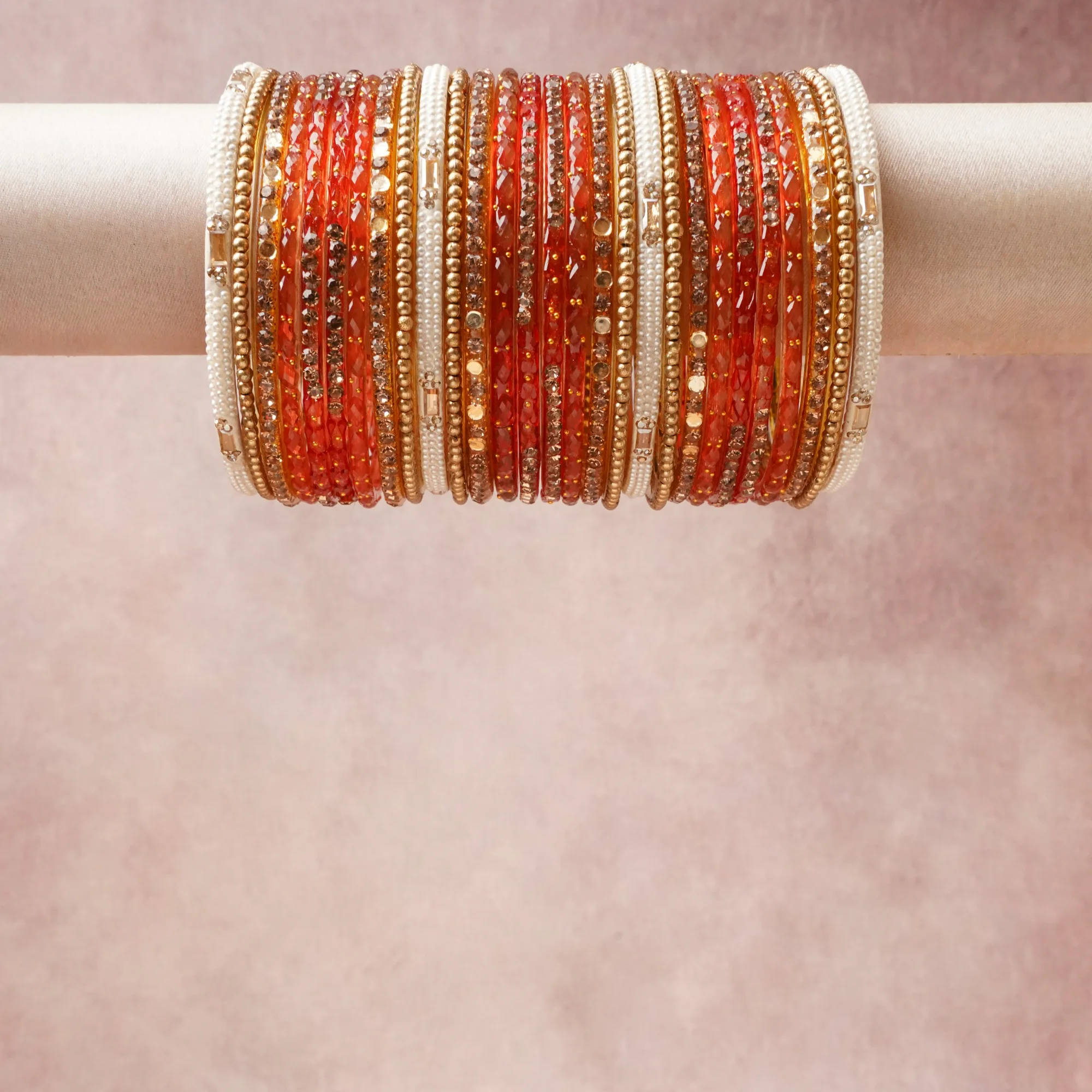 A grounding Vermillion Red forms the heart of the set, while touches of Antique Gold, Pearl White, Clear Crystal add charm.

A thoughtful composition of Glass, Gold-toned Metal, Faux Pearls, Crystals, designed to feel complete without being heavy.
Each element layers seamlessly, creating a look that is refined, wearable and quietly striking.